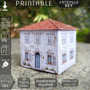 May include: A printable 3D paper model of a house with a red tile roof, white stone walls, and blue door. The model includes windows with shutters and the text "PRINTABLE", "ARTSVILLE DIY", "3D PAPER MODEL", and "INSTRUCTION INCLUDED".