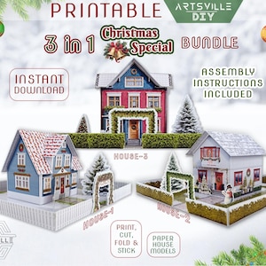 以下が含まれることがあります： 印刷可能なクリスマス3-in-1バンドル、ペーパーハウスモデルが特徴です。画像には、青い家、赤い家、白い家など、詳細なデザインの3つのミニチュアハウスが表示されています。「インスタントダウンロード」と「組み立て説明書付き」というテキストが含まれています。