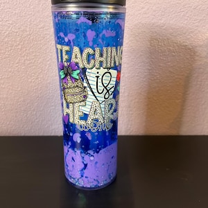 May include: A set of three ceramic nesting bowls in shades of blue, green, and white. The bowls have a speckled glaze and a simple design. The largest bowl is approx. 18 cm in diameter.