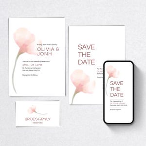 Pode incluir: Um conjunto de papelaria de casamento com um delicado design floral em tons de rosa. O conjunto inclui convites, um cartão de save-the-date, um cartão de visita e um smartphone exibindo uma mensagem de save-the-date. O texto inclui os nomes Olivia & Jonh.