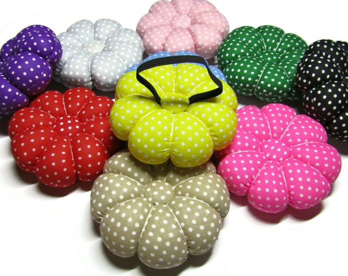 Wrist pin cushion in polka dot patterns in 10 different colors with elastic