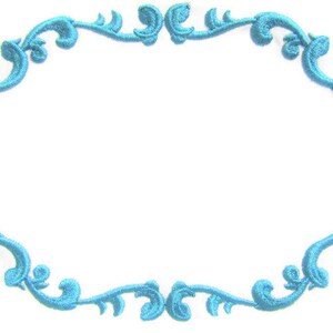 May include: A blue decorative frame with a swirling, ornate design. The frame is oval shaped and has a white background.
