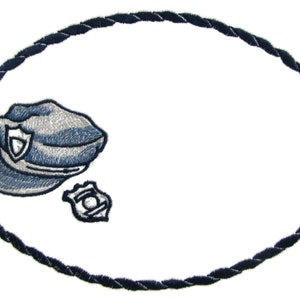 May include: A blue and white police officer's hat and badge on a white oval name tag with a dark blue rope border.