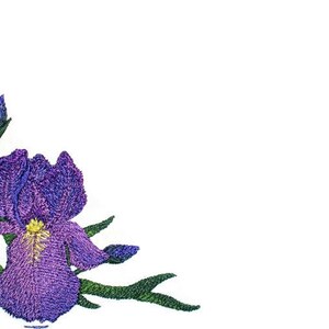 May include: Embroidered corner design featuring a purple iris flower with yellow accents and green leaves. The floral design is set against a white background, creating a delicate and detailed botanical illustration.