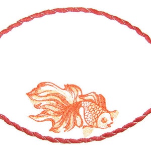 May include: An oval-shaped embroidery design with a red rope border. A stylised orange goldfish with a red tail fin is in the centre of the design.