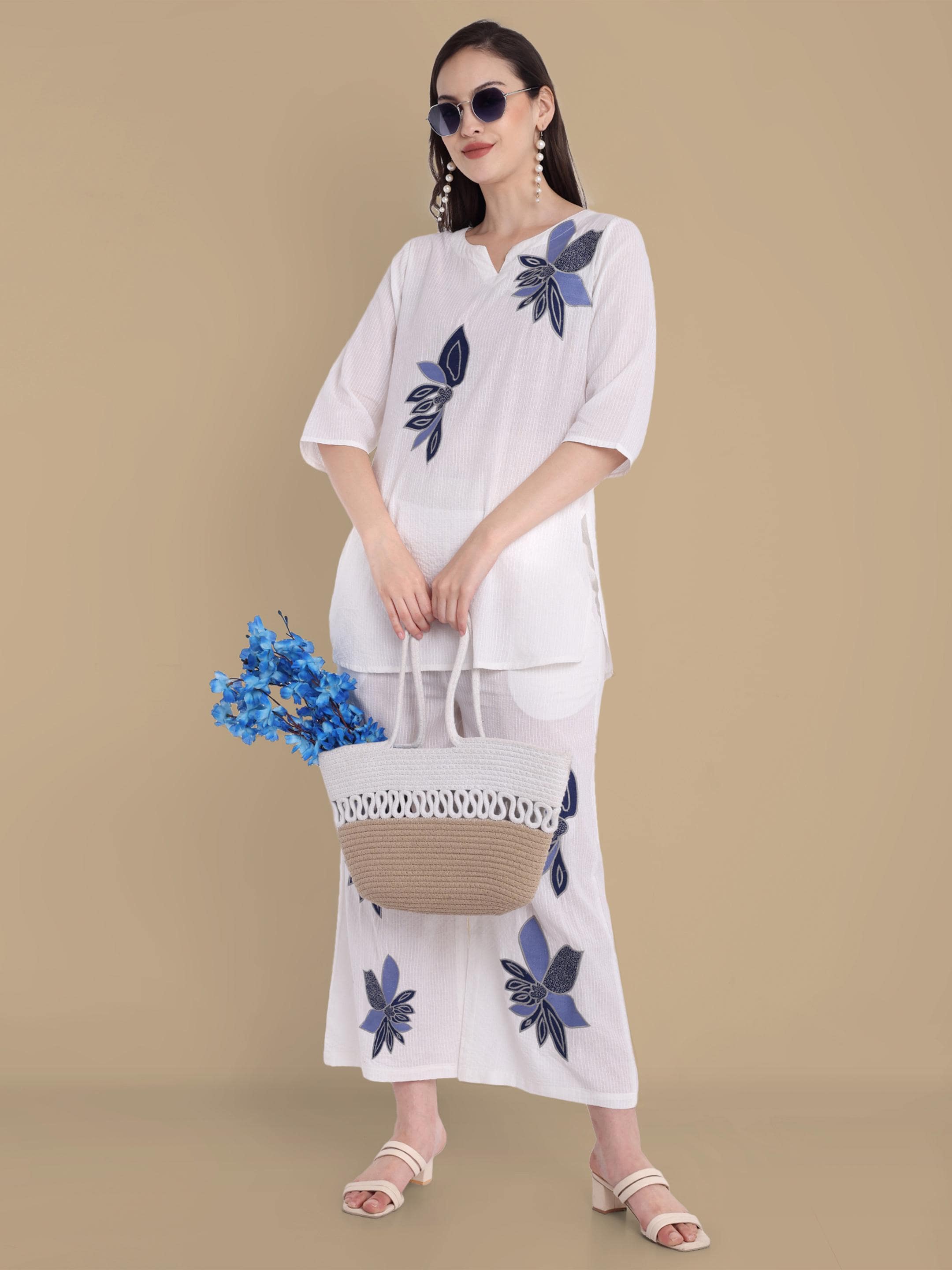 White co-ord set with blue embroidred flowers