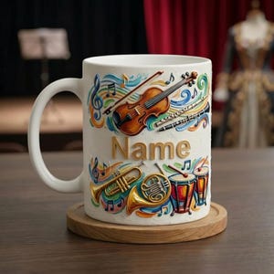 May include: White ceramic mug featuring musical instruments like a violin, trumpet, and drums, with musical notes and the word "Name" in gold lettering. The mug sits on a wooden coaster.