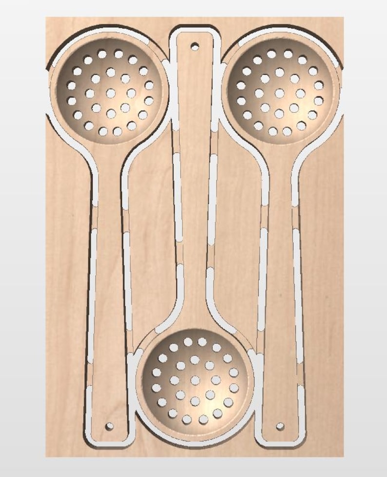 May include: A light-colored wooden board featuring three laser-cut slotted spoons. Two spoons are positioned vertically at the top, while the third spoon is centered below them, all integrated into the flat wooden surface with visible cutouts.