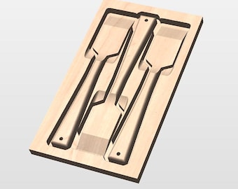 May include: A wooden tool organizer with three chisels. The chisels are arranged in a rectangular wooden tray. The chisels have a flat, rectangular blade and a long handle. The wood has a light brown color.