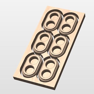 May include: A wooden tray with six recessed oval-shaped compartments, each designed to hold two circular objects. The tray and compartments are a light brown color, with a smooth finish. The design suggests a storage or organizational purpose.
