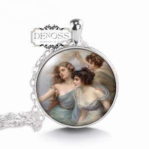 May include: A silver-toned pendant necklace featuring a circular frame containing a printed illustration of three figures in flowing garments. The text DENOSS JEWELRY & GIFT is printed in black on a white rectangular label above the pendant.