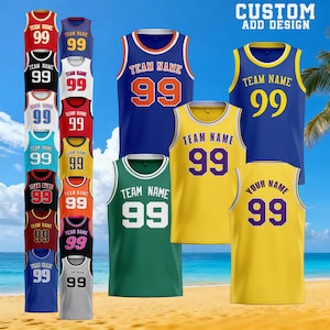 May include: A collection of basketball jerseys in various colors, including red, black, blue, and yellow. Each jersey features the number "99" and the text "TEAM NAME" or "YOUR NAME". The phrase "CUSTOM ADD DESIGN" is at the top.