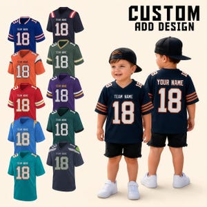 May include: A collection of custom sports jerseys in various colours including blue, orange, red, green, purple, and teal, each featuring the text TEAM NAME and the number 18. The text CUSTOM ADD DESIGN is displayed at the top right of the image.