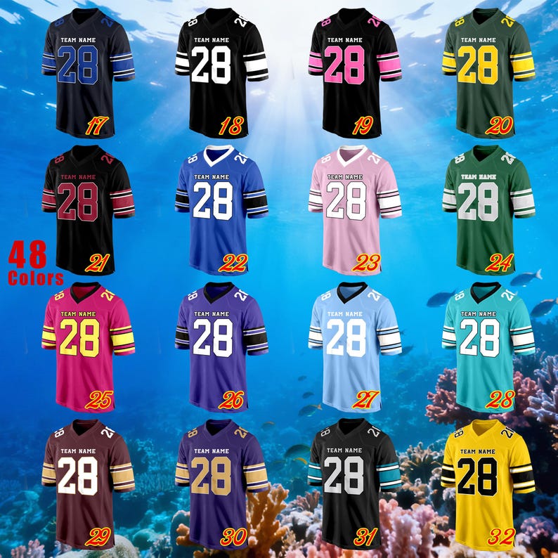 May include: A selection of football jerseys in diverse colours, such as black, blue, green, pink, and yellow. Each jersey displays the number "28" on the front and back, with "TEAM NAME" above. The jerseys have different coloured stripes on the sleeves.
