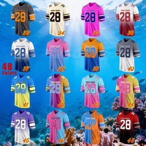 May include: A selection of sports jerseys in diverse colours, each displaying the number "28". The jerseys have contrasting colour schemes, with the text "TEAM NAME" above the number. The image presents a variety of designs.
