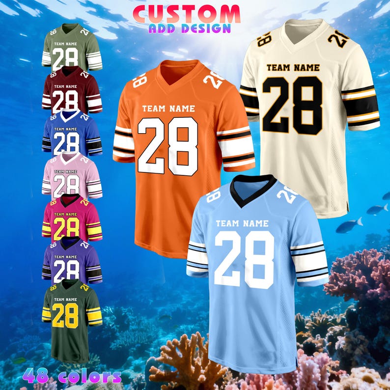 May include: A selection of football jerseys in colours such as orange, cream, and blue. Each jersey displays the number 28 and has space for a team name. The image includes the text "CUSTOM ADD DESIGN" and "48 colours".