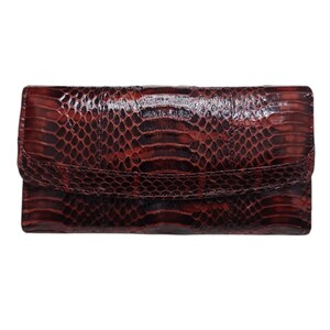 May include: A rectangular, dark red clutch bag with a flap closure. The bag is made of a snakeskin-like material, featuring a scale pattern in shades of red and brown. The design is simple and elegant, suitable for various occasions.