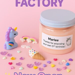 May include: A jar of peach-coloured slime with a light blue lid, surrounded by unicorn and rainbow figurines, heart-shaped sprinkles, and an ice cream cone. Text on the jar reads "Marlee, Thanks for attending your own 5th birthday!" and "Slime Time Factory, Now Open for Orders!"