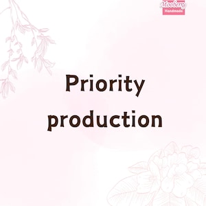 May include: A light pink background with the words "Priority production" in dark brown. The image has floral and leaf illustrations in the corners and the top left. The Mooberry Handmade logo is in the top right corner.