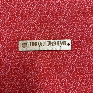 Red and White Swirl Cotton Fabric sold in the half and full yard lengths.