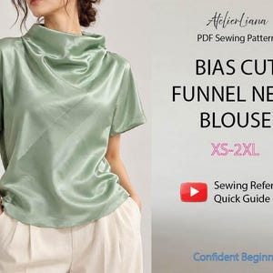 May include: A sage green satin blouse with a funnel neck and short sleeves. The text reads: AtelierLiana, PDF Sewing Pattern, BIAS CUT FUNNEL NECK BLOUSE, XS-2XL, Sewing Reference Quick Guide, Confident Beginner. The blouse is paired with light trousers.