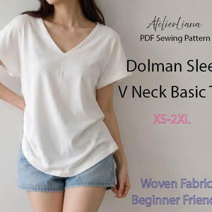May include: A white V-neck top with dolman sleeves and blue denim shorts. Text on the image reads: AtelierLiana, PDF Sewing Pattern, Dolman Sleeve, V Neck Basic Top, XS-2XL, Woven Fabric, Beginner Friendly.