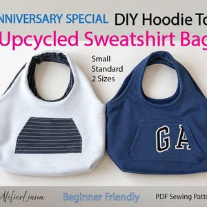 May include: Two upcycled sweatshirt tote bags in small and standard sizes. The left bag is light gray with a dark striped front pocket. The right bag is navy blue with a front pocket featuring the white text GA. Text includes 1ST ANNIVERSARY SPECIAL DIY Hoodie Tote Upcycled Sweatshirt Bag.