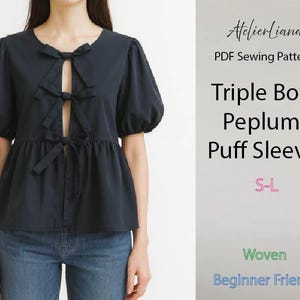 May include: A dark navy blue blouse featuring puff sleeves, a peplum waist, and three front bow closures. The text reads: AtelierLiana, PDF Sewing Pattern, Triple Bow Peplum Puff Sleeve, S-L, Woven, Beginner Friendly.