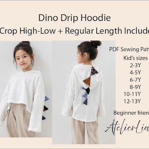 May include: White Dino Drip Hoodie with a high-low crop and regular length options. The hoodie features a dinosaur spine design on the back and is available in kid's sizes 2-13Y. The PDF sewing pattern is beginner friendly.