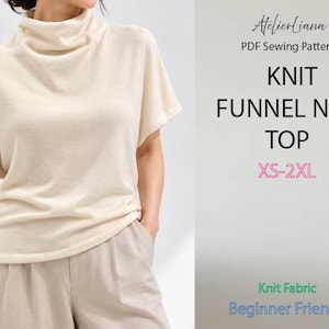 May include: A cream-coloured knit funnel neck top with short sleeves and a relaxed fit. The text on the right reads AtelierLiana PDF Sewing Pattern, KNIT FUNNEL NECK TOP, XS-2XL, Knit Fabric, and Beginner Friendly in various colours and fonts.