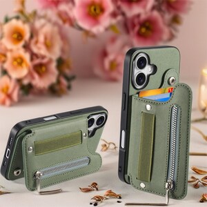 May include: Olive green phone case with a wallet feature. The case has a zippered pocket, a card slot, and an elastic band. The phone case is shown in two different positions, one standing upright and the other lying down.