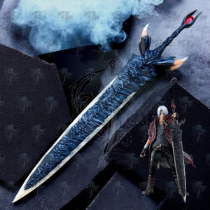 May include: A detailed, blue and silver fantasy sword with a textured blade and ornate hilt, featuring a red gem. A figurine of a character holding a similar sword is also present. The background is dark with a smoky effect.