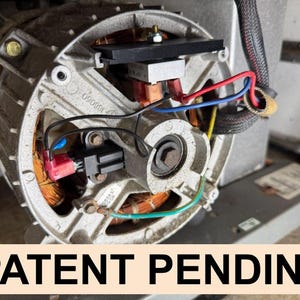 May include: An electric motor assembly featuring a silver metal housing, exposed copper wire windings, and various electrical components including black, red, blue, and green wires. The text PATENT PENDING is displayed in bold black letters.