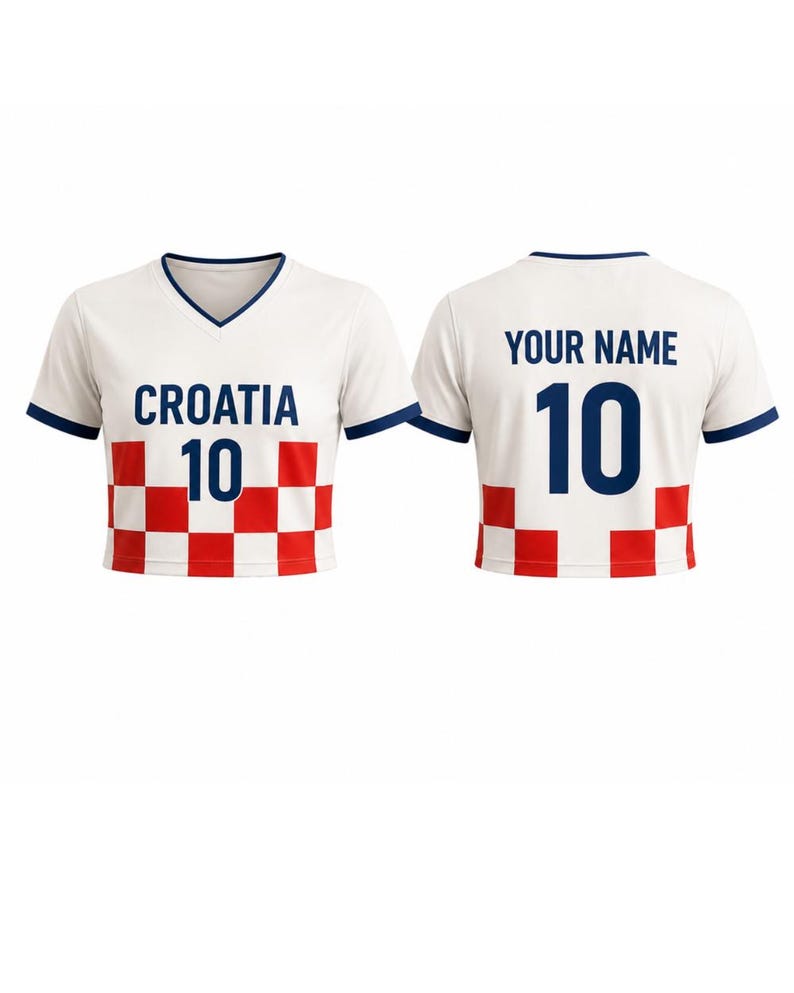 May include: White Croatia soccer jersey with a V-neck and navy blue trim. The front displays "CROATIA" and the number "10" in navy blue, above a red and white checkered pattern. The back features "YOUR NAME" and the number "10".