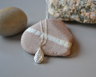 tear drop pendant with gold, silver, gold granulation, cuttlefish cast, recycled, eco silver, texture, beach jewellery, gold detail, ripple