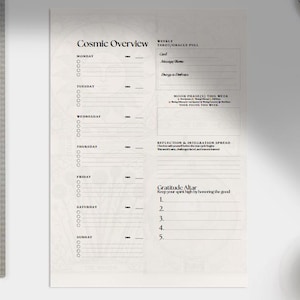 May include: A weekly planner titled "Cosmic Overview" with sections for each day of the week. It features sections for weekly tarot/oracle pulls, moon phases, reflection, and gratitude. A metal ruler is on the left.