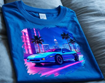 Neon Fiero T-Shirt, 80s Retro Car Graphic Tee. A Blue Fiero with neon reflections in front of a city skyline. 80s retro vibe!