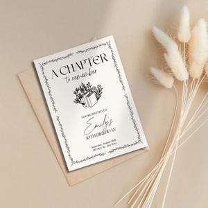 May include: An invitation card with the text "A CHAPTER to remember" and "Emily's 30th Birthday" in black font. The card has a floral and leaf border and is on a beige envelope. Dried flowers are in the background.