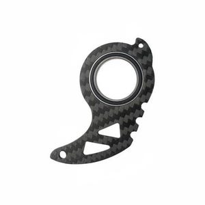 May include: A carbon fiber tool with a central circular opening and a textured surface. The tool has a unique shape with a series of small teeth along one edge and two triangular cutouts. The tool is designed for a specific purpose.