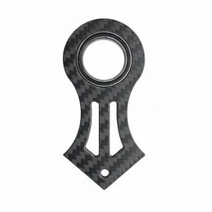 May include: A carbon fiber keychain with a unique design. The keychain features a circular top with a central hole, a central body with two vertical cutouts, and a diamond-shaped bottom with a small hole.