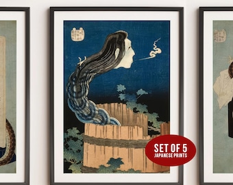 May include: A set of 5 framed Japanese prints. The central print depicts a long-haired figure with a pale face, emerging from a wooden structure against a dark blue backdrop. The prints are framed in black.