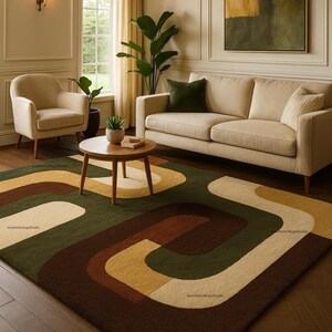 May include: A living room scene featuring a beige sofa, armchair, and a round wooden coffee table. A colorful rug with a retro design in shades of brown, green, and cream covers the floor. A painting hangs on the wall, and a large plant adds a touch of nature.