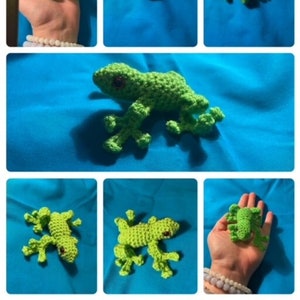 May include: A green crocheted gecko toy with black eyes. The gecko is posed on its four legs with its tail curled up. The gecko is about 4 inches long.