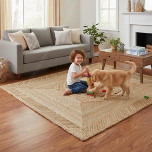 Child and golden retriever playing blocks on beige braided jute rug by gray sofa fireplace in cozy living room.