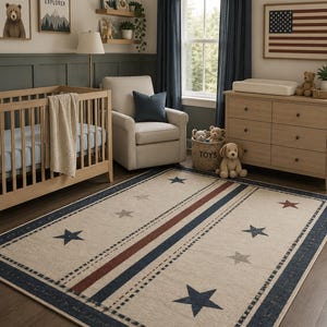 May include: A rectangular area rug featuring a cream-colored center with scattered navy blue, grey, and red stars. The rug is bordered by thick navy blue stripes and a dotted pattern, creating a patriotic design that covers the floor of the room.