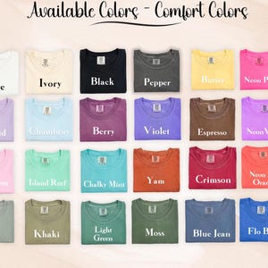 May include: A color chart displaying twenty-four t-shirts in various shades labeled Available Colors - Comfort Colors. The colors include white, ivory, black, pepper, butter, neon pink, orchid, chambray, berry, violet, espresso, neon violet, blossom, island reef, chalky mint, yam, crimson, neon red orange, bay, khaki, light green, moss, blue jean, and flo blue.