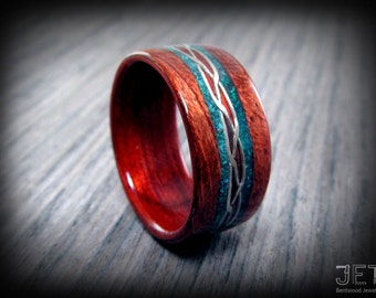 Bolivian Rosewood Bentwood Ring with Sterling Silver Wire Celtic Knot Inlay and Crushed Turquoise Accents on both side of the wire inlay.