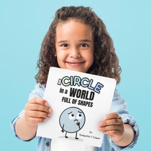 May include: A child holds a book titled "A Circle in a World Full of Shapes." The book cover features a cartoon circle with a sad expression. The author's name, Kimberlita Y. Casper, is also visible.