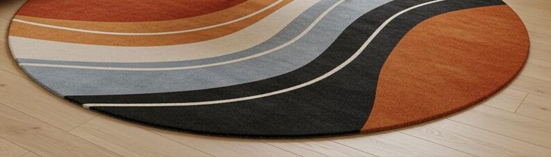 May include: A round rug with a wave design in shades of orange, tan, gray, and black. The rug has a soft texture and a modern aesthetic, suitable for living rooms or bedrooms. The rug's diameter is approximately 60 inches.
