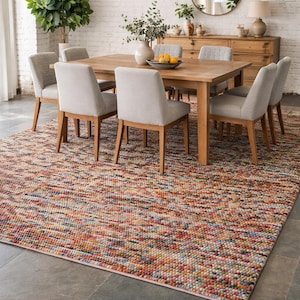 May include: A dining room set with a wooden table and six upholstered chairs. A colorful area rug with a textured pattern covers the floor. A woven pendant light hangs above the table, and a mirror is on the wall.